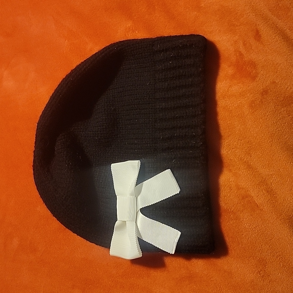 Kate Spade Black Knit hat with white bow.